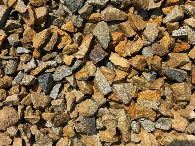 Golden granite chippings by an unknown vendor, about 20mm in size, for gardens.