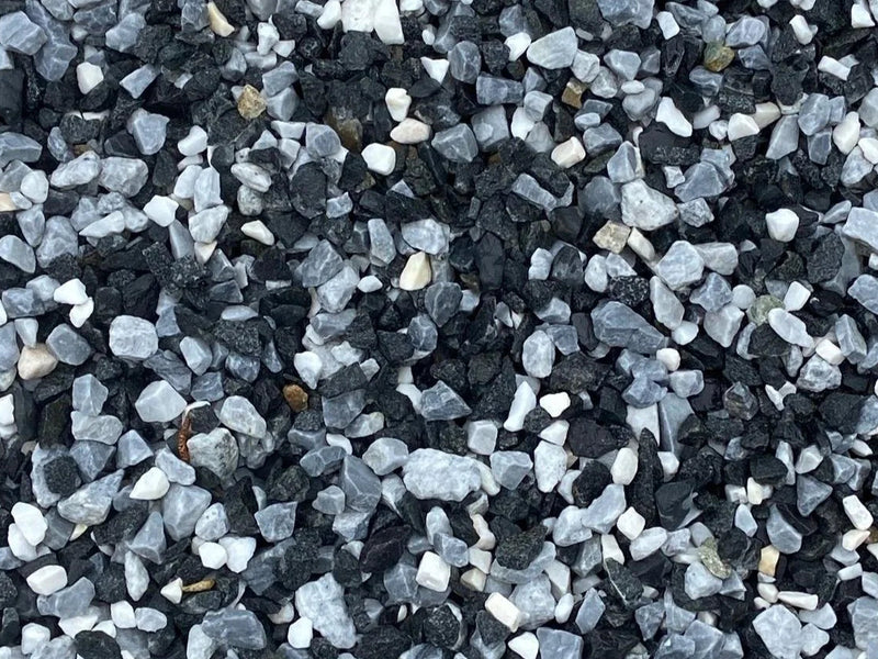 Black and white pond chippings by brand absent, displaying angular and irregular rock fragments with rough textures.