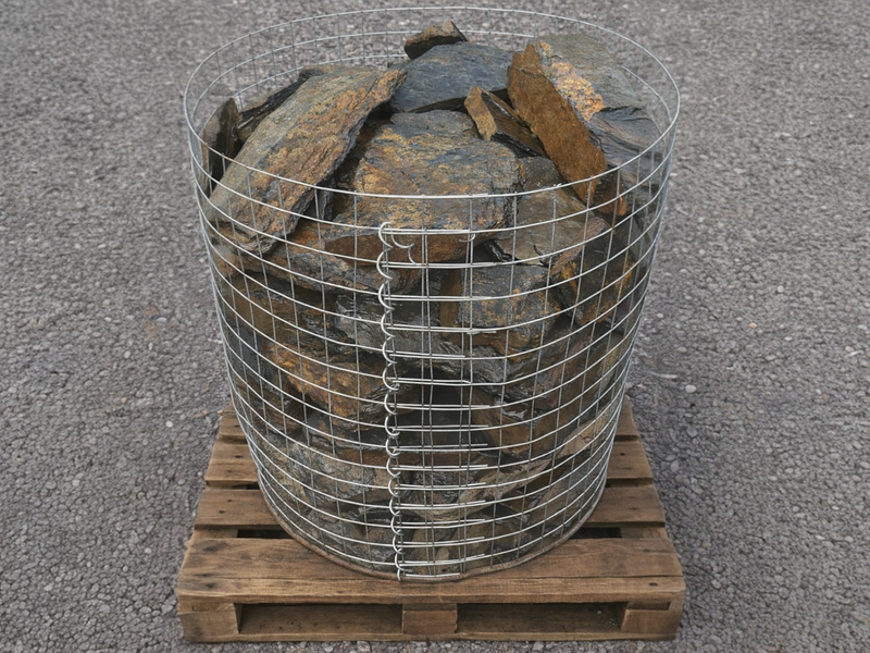 Rustic slate decorative pond stones with golden brown accents on a wooden pallet.