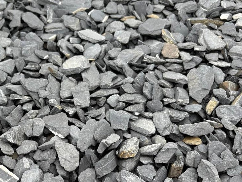 Grey slate chippings for pond edging with 40mm stones, featuring varying rock sizes and textures.