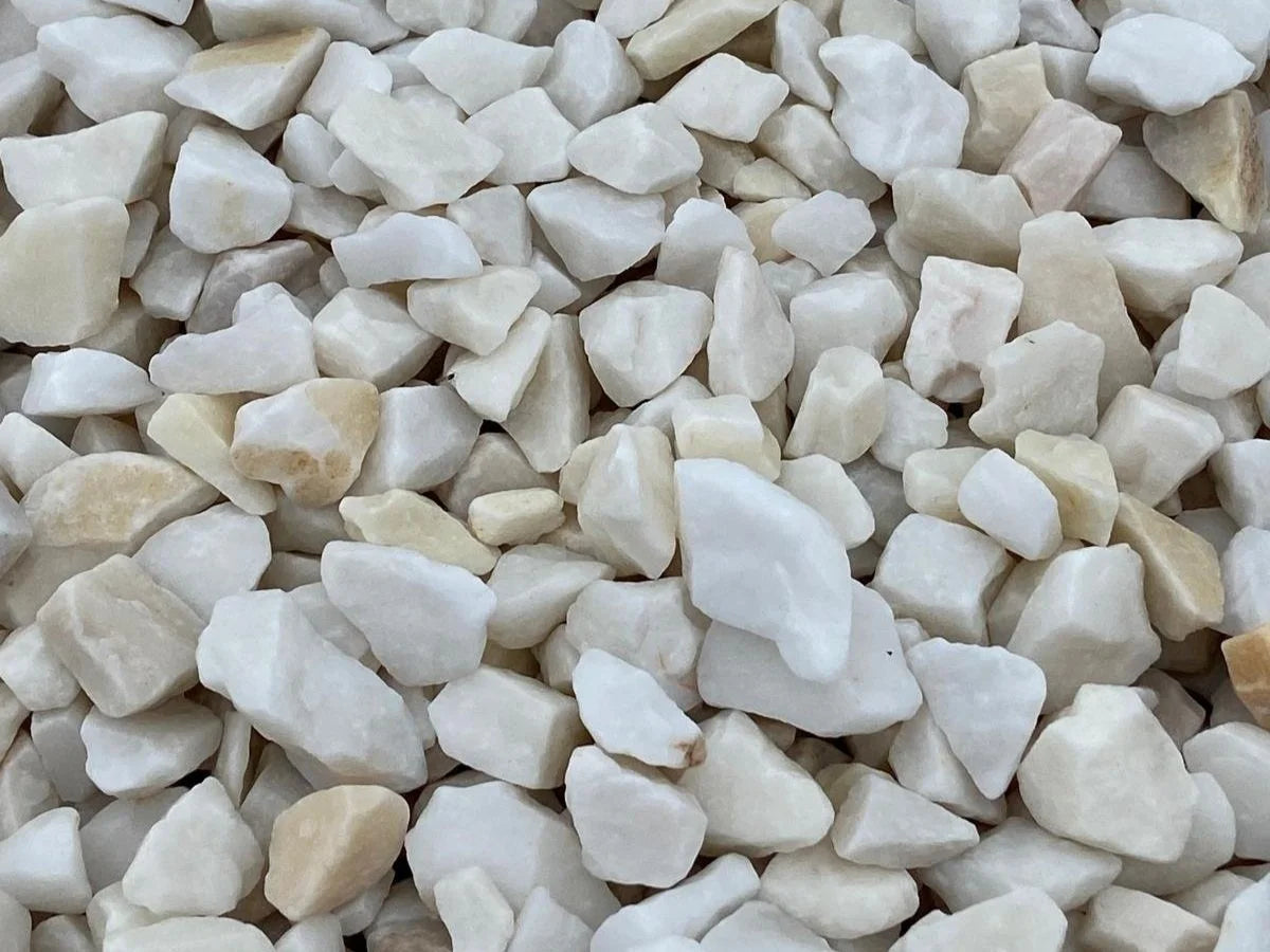White marble pond chippings, 20mm, with slight beige veining.