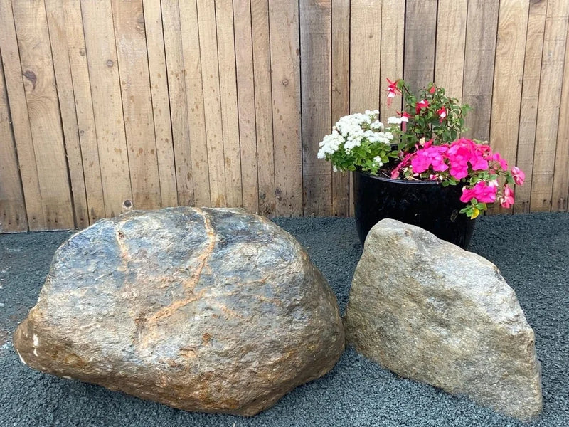 Decorative garden boulders, 400-600mm, with visible ridges and varying colors.