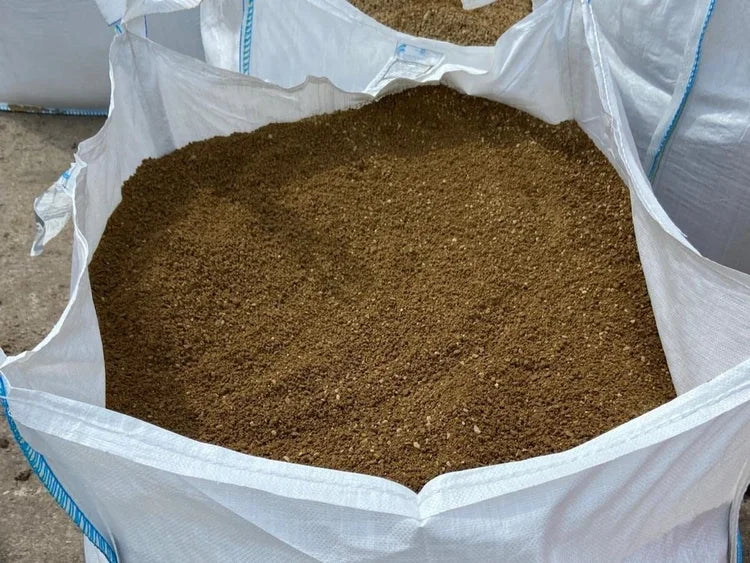 Bulk bag of golden granite self bind, with visible gravelly texture.
