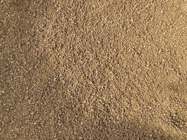 Golden granite self bind by unknown vendor, featuring a rough, granular texture.