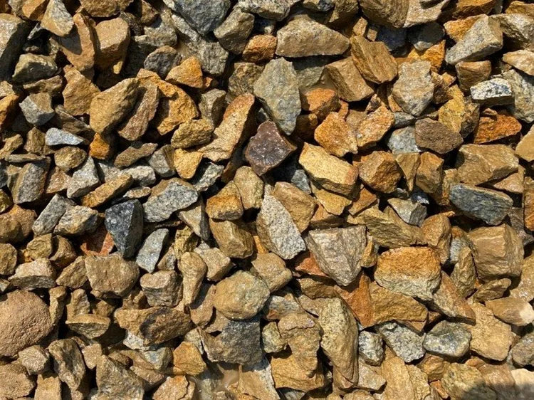 Golden granite chippings from an unmentioned brand showing a rough, angular texture.