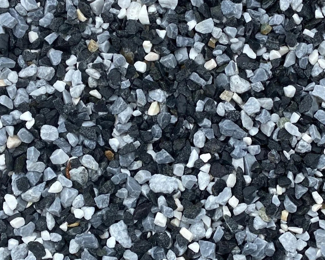 Black and white pond chippings by brand absent, displaying angular and irregular rock fragments with rough textures.