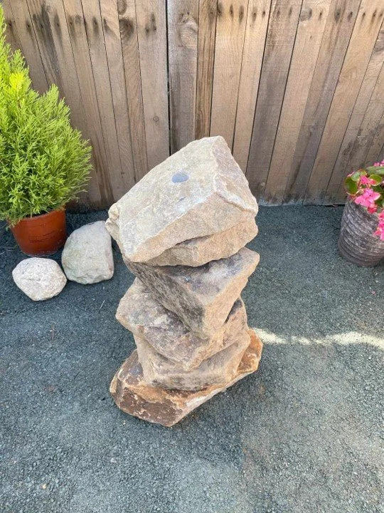 Golden granite water feature, 600mm tall, stacked in a staggered cairn shape with rough, natural edges.