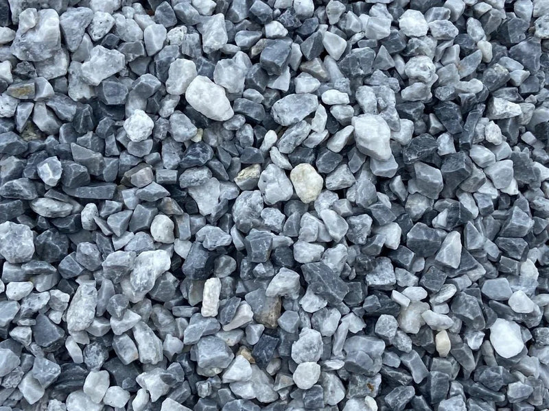 Blue chippings by Alpine in a bulk bag, showing a pile of small, angular stones.
