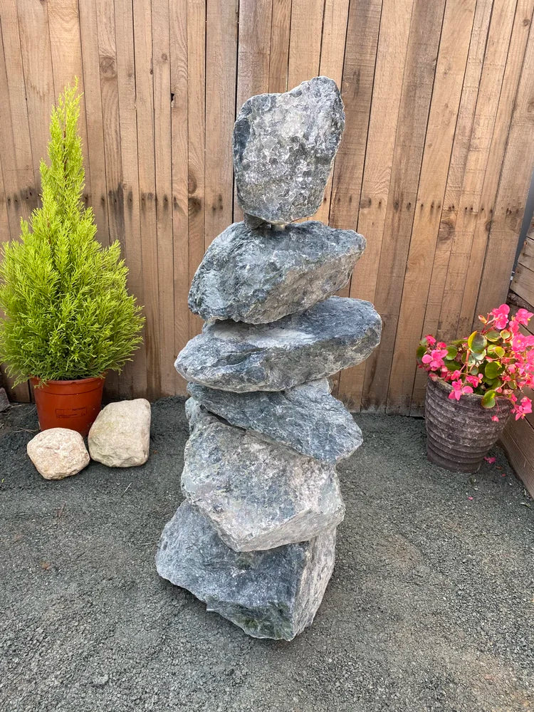Medium green granite pyramid stacked stone by Unbranded with weathered rock texture.
