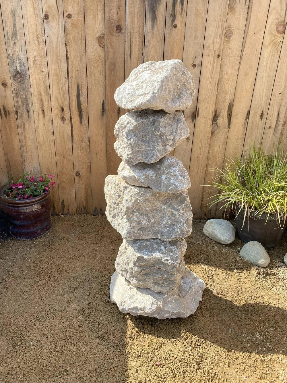 Medium grey limestone pyramid stacked stones at 800mm tall with natural stone texture.