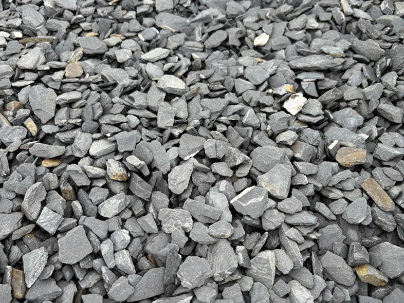 Grey slate chippings for pond edging with visible stone texture.