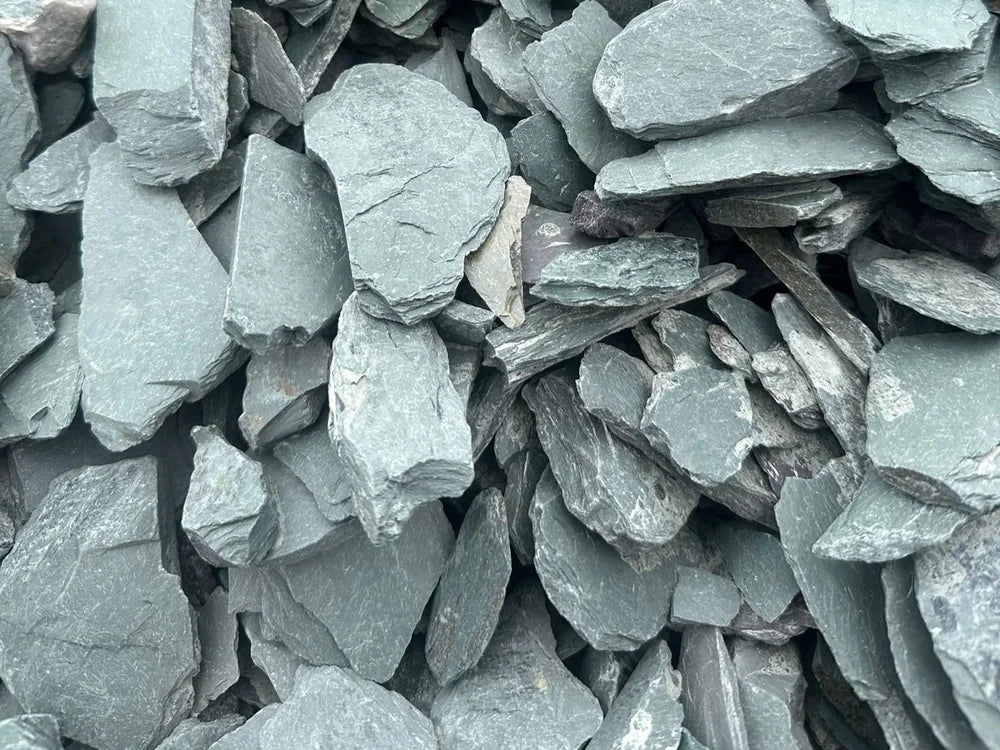 Green slate pond chippings, 40mm, with a rough, layered texture.