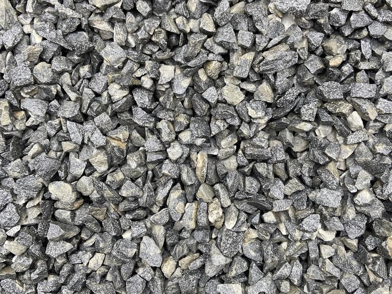 Black granite chippings by Bulk Bag, showing a rough, angular texture.