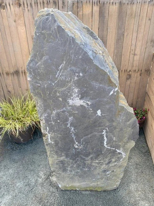 Grey slate monolith standing stone, approximately 1300mm tall, with natural white veining and rough texture.

